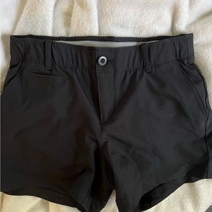 Under Armor golf shorts.